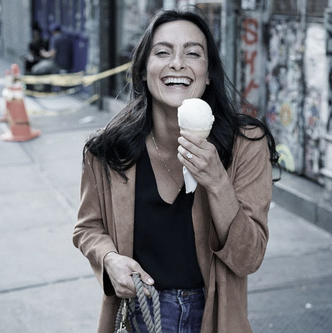 Food Confidence-Image of a happy woman eating ice cream cone, muted tones